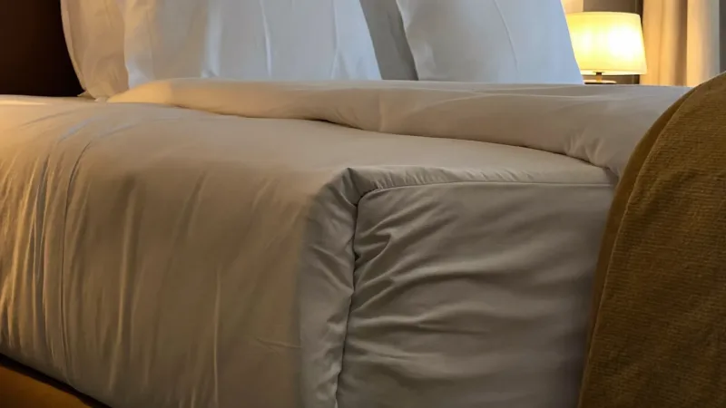 Styled bedroom detail in a partner property